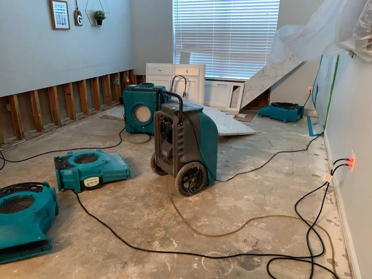 Dehumidifier in flood-cut room for Water Damage Restoration in San Marcos